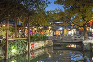Canalside restaurant at dusk, Lijiang (UNESCO World Heritage Site), Yunnan, China