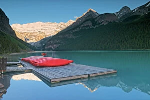 Images Dated 20th April 2023: Canoes on dock. Victoria Glacier on Mt. Victoria at Lake Louise. On the right is Mt