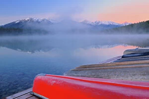 Images Dated 3rd May 2023: Canoes and Pyramid Lake in fog at dawn, Jasper National Park, Alberta, Canada