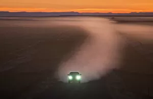 Dust Gallery: Car on gravel road in Badlands, South Dakota, USA