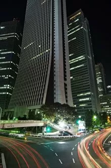 Shinjuku Gallery: Car light trails under skyscrapers and city buildings