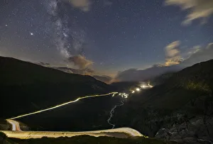 Furkapass Prints: Car lights and milkyway from Furkapass to Grimselpass during summer, Uri, Canton Vallese