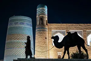 Camel Prints: Caravan with drover and camels sculpture, Khiva, Uzbekistan