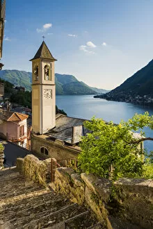 Careno, lake Como, Como province, Lombardy, Italy. The towns bell tower and the lake