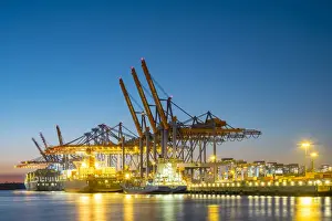Industrial Prints: Cargo ships being loaded at Burchardkai in Hamburg Harbor at night, Waltershofer Hafen