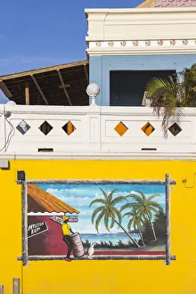 Caribbean, Netherland Antilles, Aruba, Oranjestad, Wall painting on side of Que Pasa