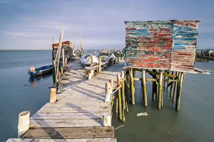 Carrasqueira, Alcacer do Sal, Setubal, Portugal. Typical wooden pillar piers