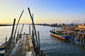 Carrasqueira, a palafitte fishing harbour at dusk. Alentejo, Portugal Carrasqueira, a palafitte fishing harbour at dusk. Alentejo, Portugal