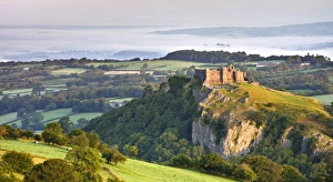 Carreg Cennen Castle at dawn on a misty summer morning, Brecon Beacons National Park