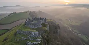 March Prints: Carreg Cennen Castle at sunrise on a misty early Spring morning