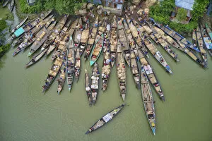 Images Dated 19th January 2021: Carrying jutes on boats for selling market, Manikganj, Bangladesh