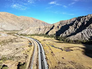 Jujuy Prints: Cars on a road winding through a valley, Tumbaya, Jujuy, Argentina