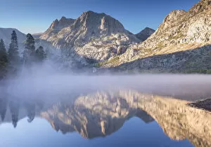 Carson Peak, reflected in the mist shrouded waters of Silver Lake on the June Lake Loop