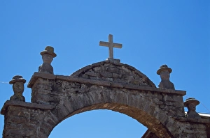 Arch Way Gallery: Carved heads of local officials decorate archway leading into plaza