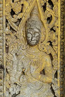 Carving Prints: Carving on a door of a temple in Luang Prabang (ancient capital of Laos on the Mekong river)
