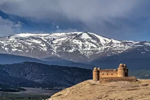Castillo de la Calahorra castle with the Sierra Nevada mountain range in the background