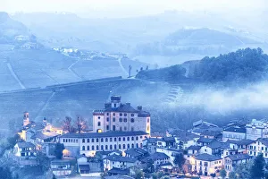 Dusks Prints: Castle and village of Barolo during a foggy dusk. Barolo wine region, Langhe, Piedmont
