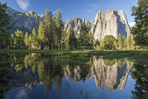 Pool Prints: Cathedral Rocks reflected in a snow melt pool in a Yosemite meadow, California, USA
