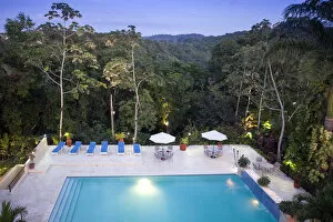 Central America, Belize, Cayo, San Igancio, view of the swimming pool and the rainforest
