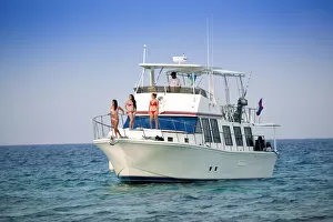 Images Dated 20th August 2013: Central America, Belize, models on a motor yacht on the cayes
