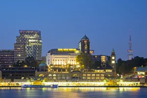 Central Hamburg skyline along Elbe River at night, looking towards St
