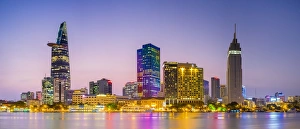Lights Gallery: Central Ho Chi Minh City (Saigon) skyline and Saigon River at dusk, Vietnam