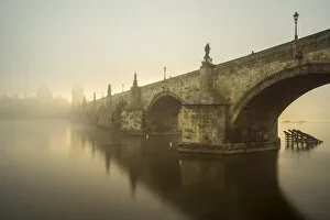 Domes Collection: Charles Bridge with mist at sunrise, Prague, Bohemia, Czech Republic