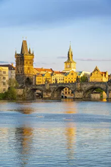 Images Dated 25th February 2022: Charles Bridge with Old Town Bridge Tower against sky at sunset, Prague, Bohemia, Czech Republic