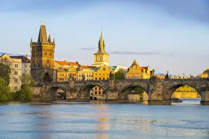 Images Dated 25th February 2022: Charles Bridge with Old Town Bridge Tower against sky at sunset, Prague, Bohemia, Czech Republic