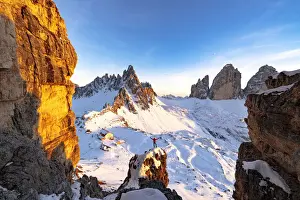 Alto Adige Prints: Cheerful man on top of rocks admiring Monte Paterno and Tre Cime di Lavaredo