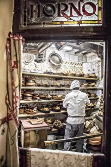 Images Dated 16th July 2020: A chef roasting pork at traditional Spanish restaurant, Botin, Madrid, Spain