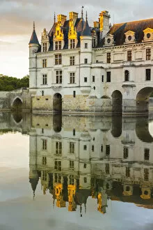 Chenonceaux Collection: Chenonceau castle reflects itself on the Loire at sunset. Chenonceaux, Indre-et-Loire