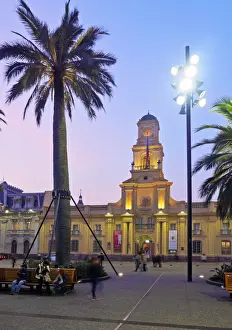 Santiago De Chile Prints: Chile, Santiago, Plaza de Armas, Twilight view towards the Royal Court Palace housing