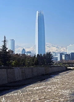 Chile, Santiago, View over Mapocho River towards the high raised buildings with Costanera