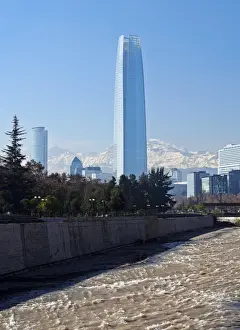 Chile, Santiago, View over Mapocho River towards the high raised buildings with Costanera