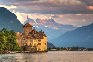 Chillon Castle (Chateau de Chillon) on shores of Lake Geneva with the Alps in background, Montreux, Canton of Vaud, Switzerland