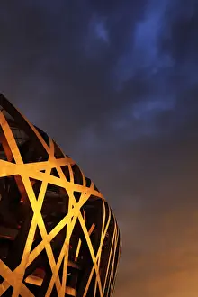 China, Beijing, Olympic park and famous birds nest stadium made of steel illuminated