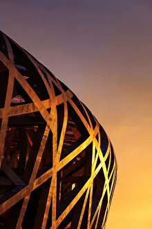 China, Beijing, Olympic park and famous birds nest stadium made of steel illuminated