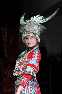 Headdress Prints: China, Guizhou, a woman wears a traditional Miao costume