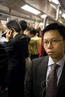 Images Dated 9th April 2008: China, Hong Kong, commuters inside a busy Metro train
