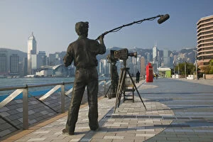 China, Hong Kong, Kowloon, Avenue of the Stars by Victoria Harbour, statue of TV interview