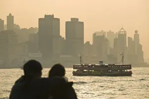Star Ferry Prints: China, Hong Kong, Kowloon, Couple silhouette with Star Ferry