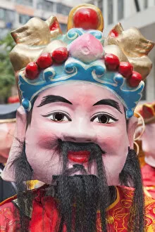 Images Dated 14th April 2011: China, Hong Kong, Tai Kok Tsui Temple Fair, Parade Participant Dressed in Lucky God