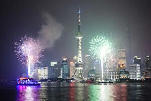 Images Dated 24th June 2014: China, Shanghai. Fireworks over Pudong business district