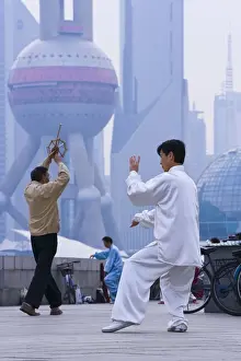 Pudong Prints: China, Shanghai, morning exercises / Tai Chi in Huangpu Park on the Bund, Pudong in