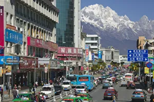 China, Yunnan Province, Lijiang, New Town, view along Xin Dajie Street towards Jade