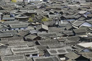 Images Dated 15th June 2009: China, Yunnan Province, Lijiang, Rooftops of Old Town from Shizi Shan