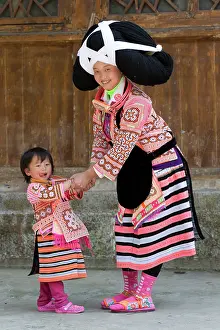 Family Prints: China, Zhonghua, Guizhou, Long-horned Miao woman playing with her daughter