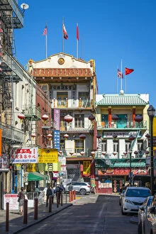 Northern California Collection: Chinese lanterns hanging over street amidst buildings in Chinatown, San Francisco
