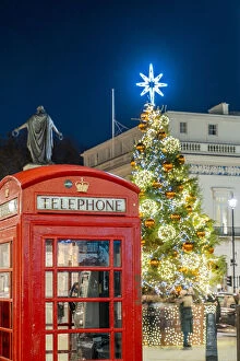 Christmas tree and red phone box, Mayfair, London, England, UK